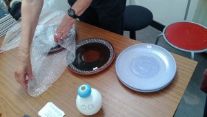Wrapping plates in bubble-wrap by dumbledad (CC BY 2.0)