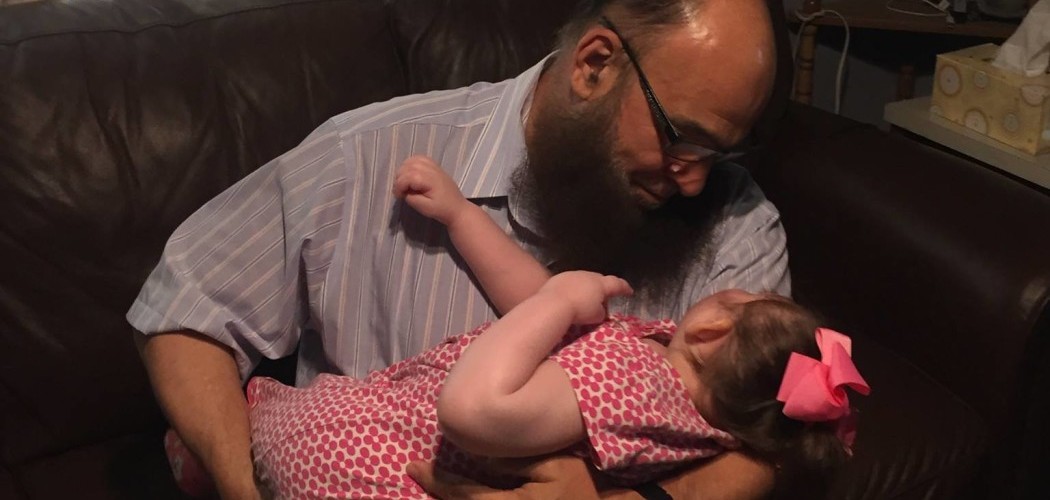 Bzeek caring for his daughter